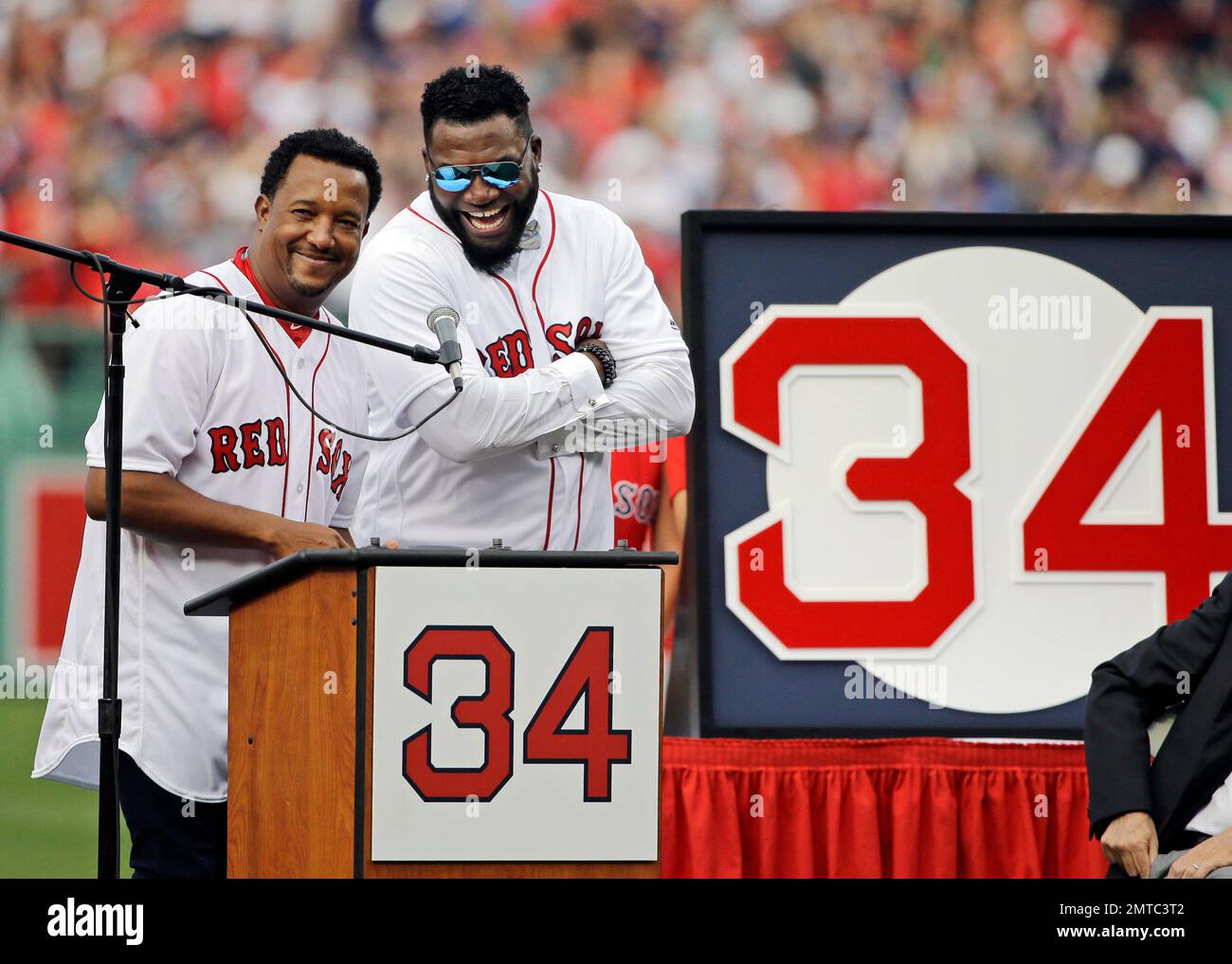 Boston Red Sox baseball great David Ortiz, right, laughs with Hall of Fame  pitcher Pedro Martinez, Friday, June 23, 2017, at Fenway Park in Boston as  the team retired Ortiz's jersey No.