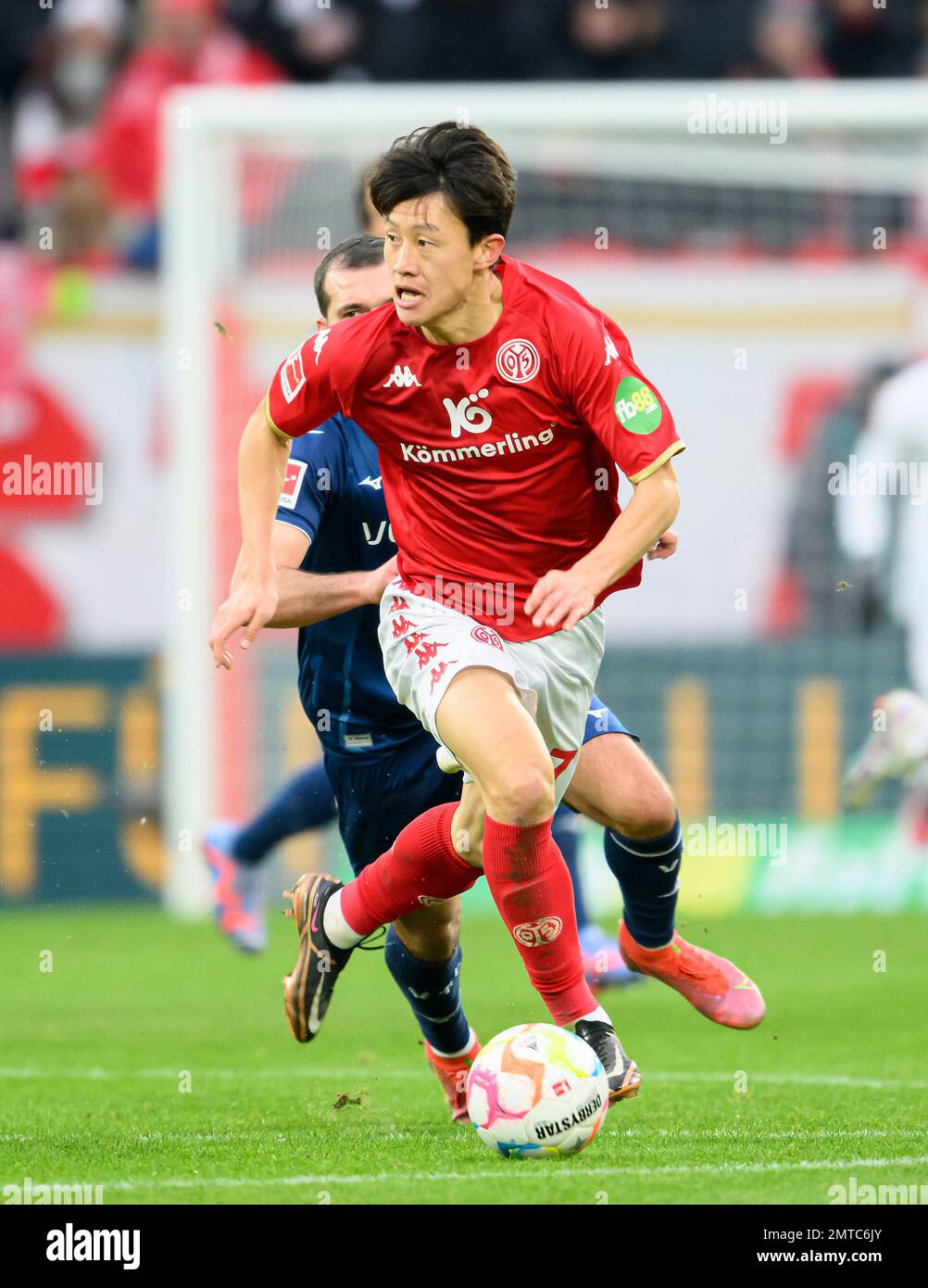 Jae-Sung LEE (MZ) action, soccer 1st Bundesliga, 18th matchday, FSV FSV FSV Mainz 05 (MZ) - VfL Bochum (BO) 5: 2, on January 28th, 2023 in Mainz/ Germany. #DFL regulations prohibit any use of photographs as image sequences and/or quasi-video # Stock Photo