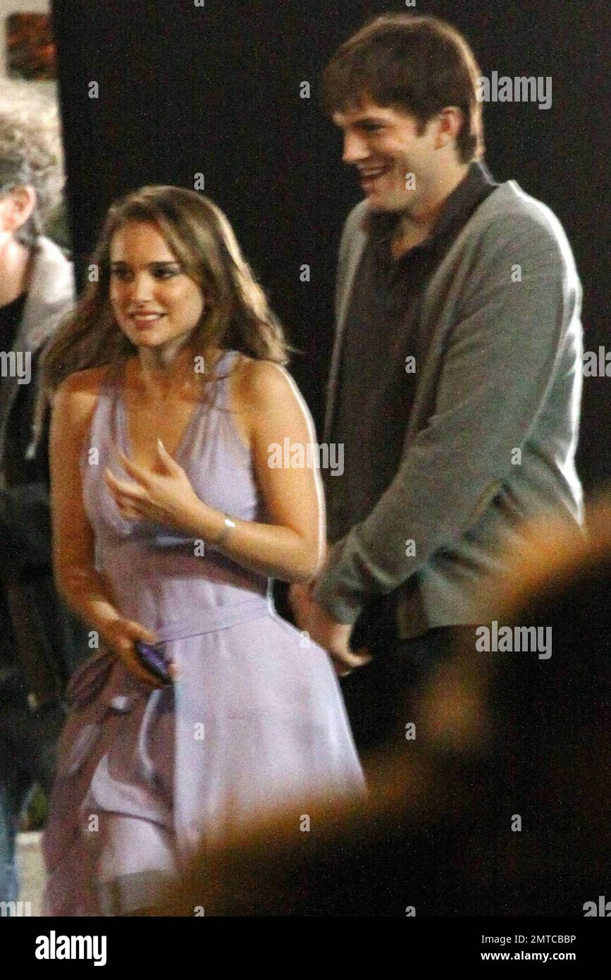Actress Natalie Portman appears very cold as she and actor Ashton Kutcher  film a night scene for their new movie "No Strings". In between scenes  Portman wore pants with her purple cocktail