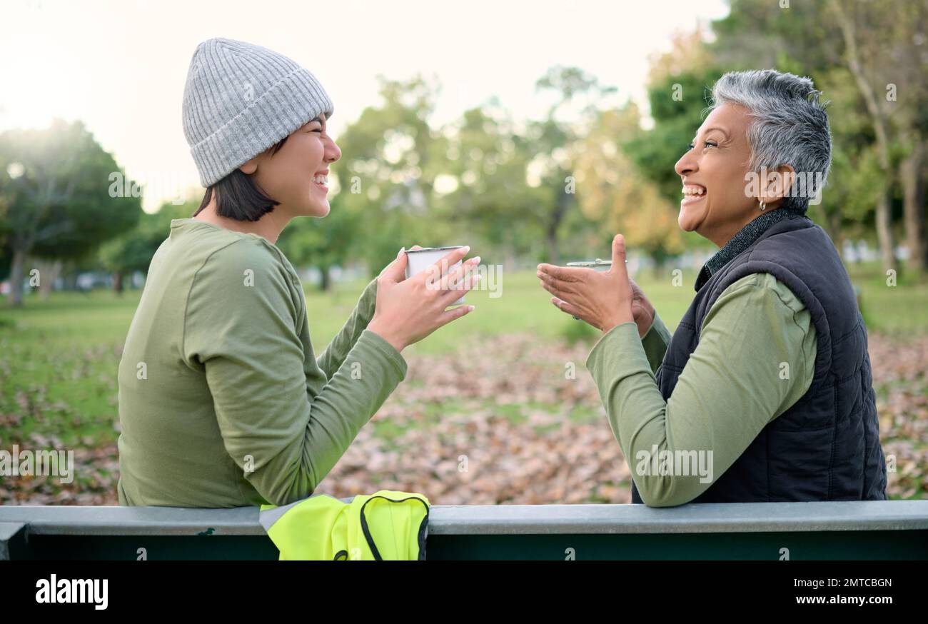 Women, coffee and volunteer relax after community, cleanup and project in a park, happy and bonding. Charity, environment and recycling friends Stock Photo
