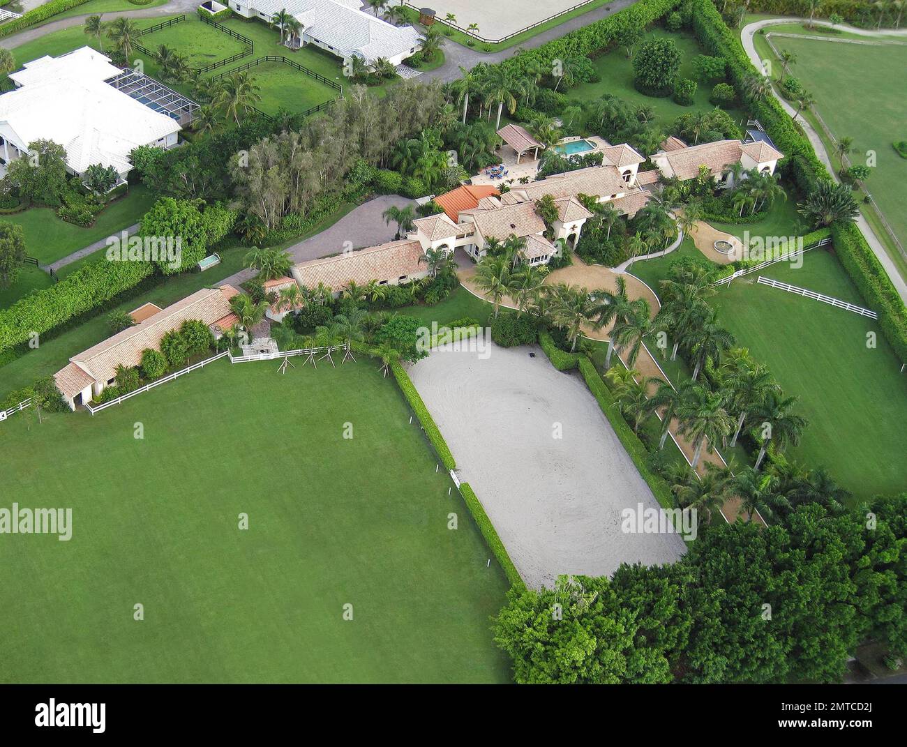 EXCLUSIVE!! Pop star Madonna is reportedly very close to purchasing an $11.9 million Tuscan-style Florida mansion.  According to reports the price of the Wellington home is down from its original listing of $13 million.  The eight-bedroom, 10,000-square-foot luxury property is situated on almost five acres of manicured, palm tree-lined land and is conveniently located beside an equestrian club.  The home also features a backyard pool and lounge area, vast dining and living rooms and horse stables.  Madonna is known to fancy the high-end sport of polo, so much so that she still rides even after Stock Photo