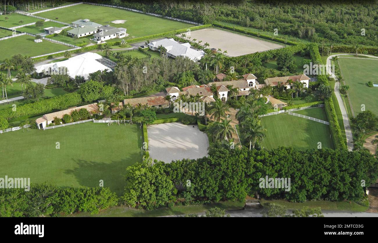 EXCLUSIVE!! Pop star Madonna is reportedly very close to purchasing an $11.9 million Tuscan-style Florida mansion.  According to reports the price of the Wellington home is down from its original listing of $13 million.  The eight-bedroom, 10,000-square-foot luxury property is situated on almost five acres of manicured, palm tree-lined land and is conveniently located beside an equestrian club.  The home also features a backyard pool and lounge area, vast dining and living rooms and horse stables.  Madonna is known to fancy the high-end sport of polo, so much so that she still rides even after Stock Photo