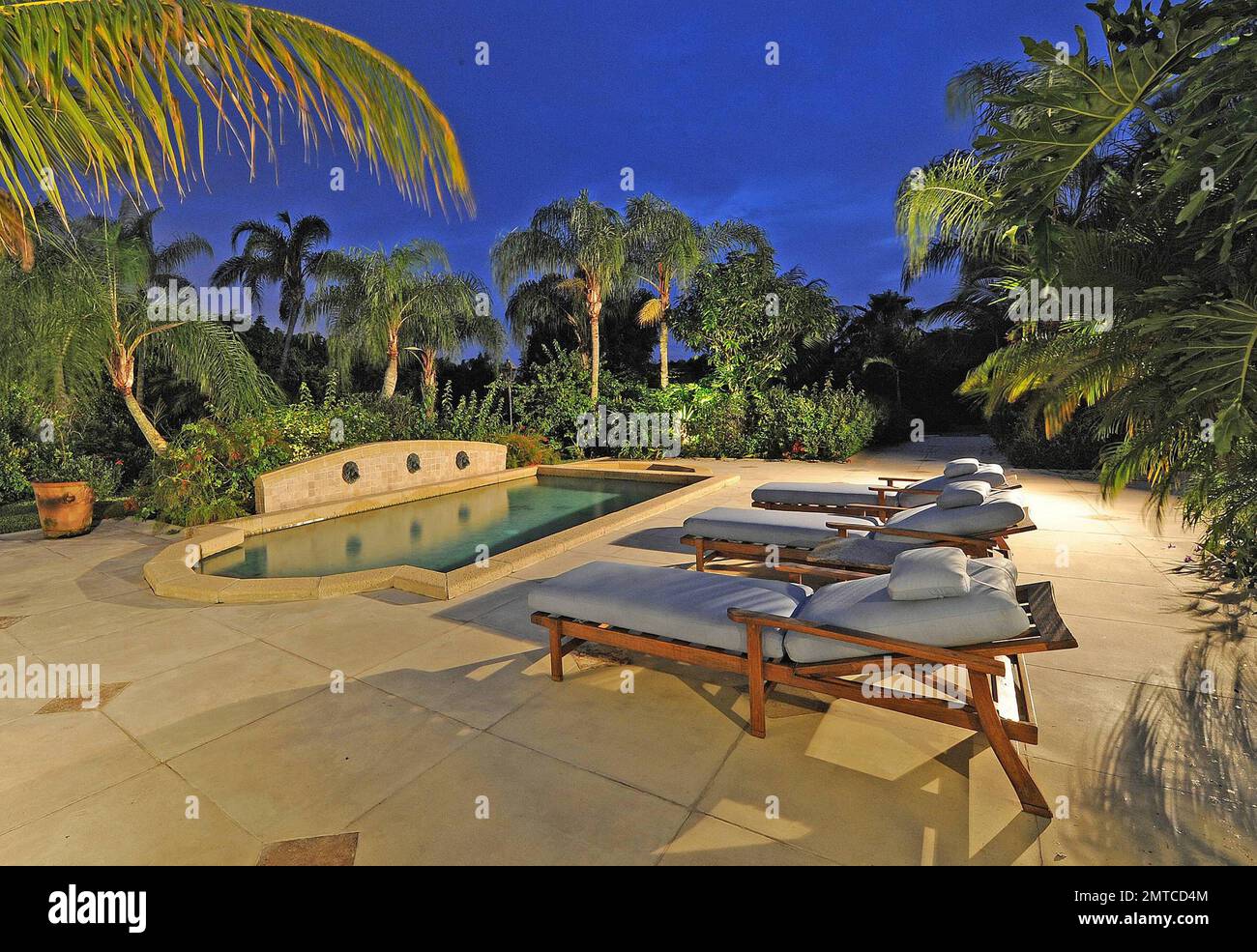 EXCLUSIVE!! Pop star Madonna is reportedly very close to purchasing an $11.9 million Tuscan-style Florida mansion.  According to reports the price of the Wellington home is down from its original listing of $13 million.  The eight-bedroom, 10,000-square-foot luxury property is situated on almost five acres of manicured, palm tree-lined land and is conveniently located beside an equestrian club.  The home also features a backyard pool and lounge area, vast dining and living rooms and horse stables.  Madonna is known to fancy the high-end sport of polo, so much so that she still rides even after Stock Photo