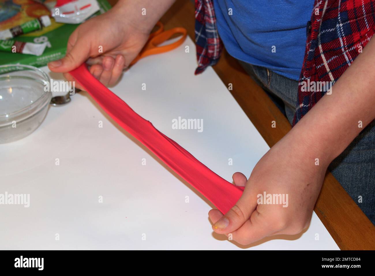 In this June 21, 2017 photo, Astrid Rubens demonstrates the elasticity of homemade slime in her