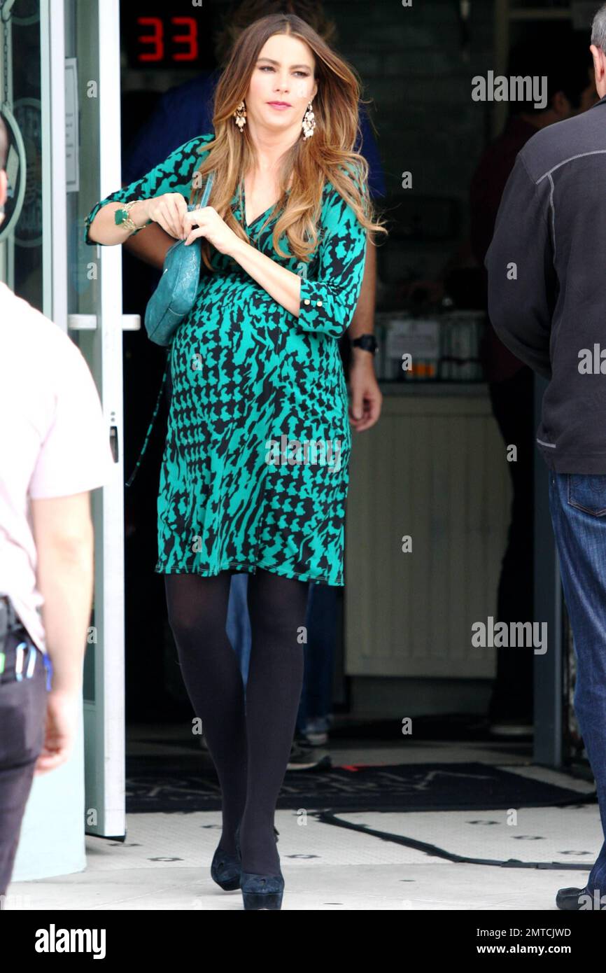 A pregnant looking Sofia Vergara shows off her fake baby bump as she