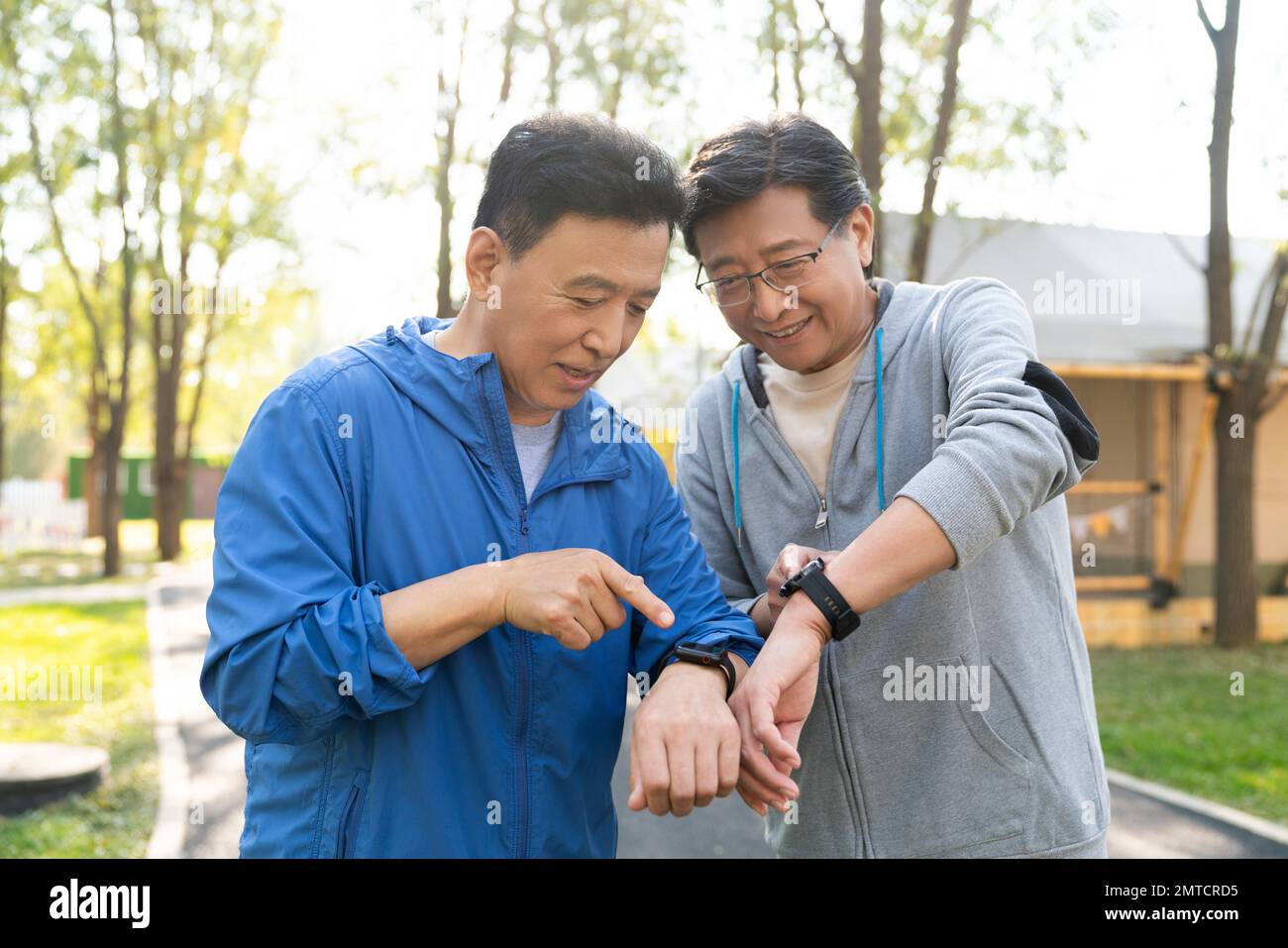 The two movements of older men look at sports watch Stock Photo - Alamy
