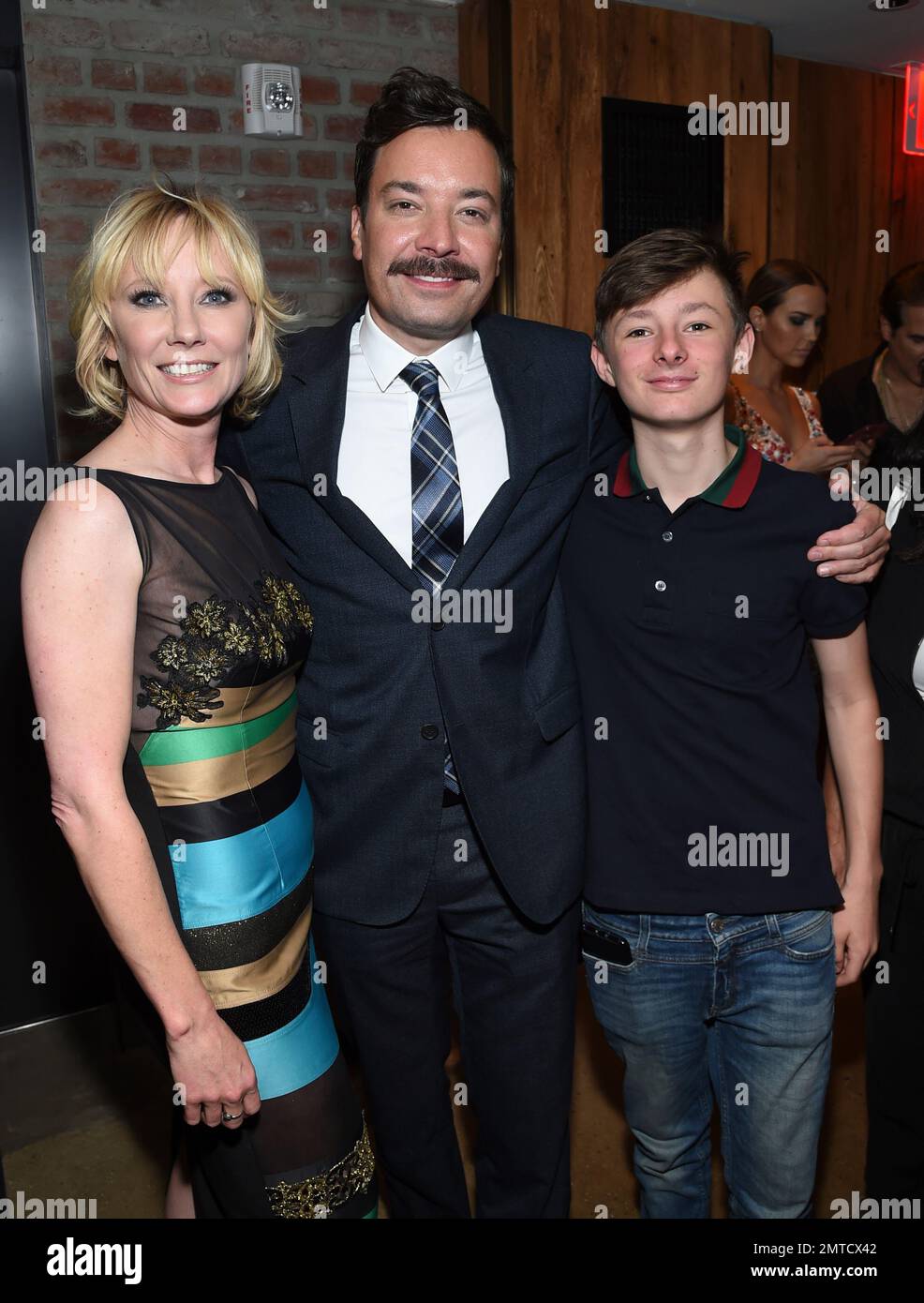 "Tonight Show" host Jimmy Fallon, center, poses with actress Anne Heche