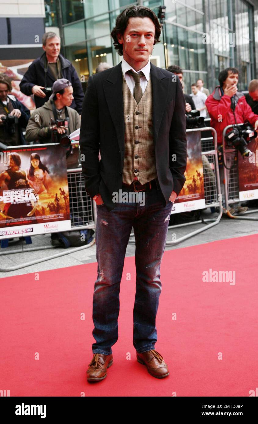 Luke Evans walks the red carpet at the world premiere of 