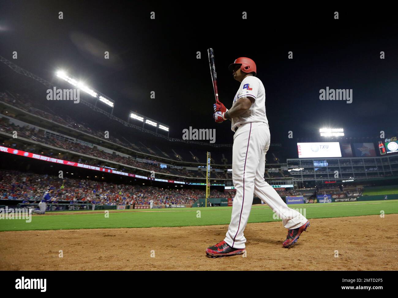 The Texas Rangers' Adrian Beltre and his son, Adrian Jr., 8, walk out