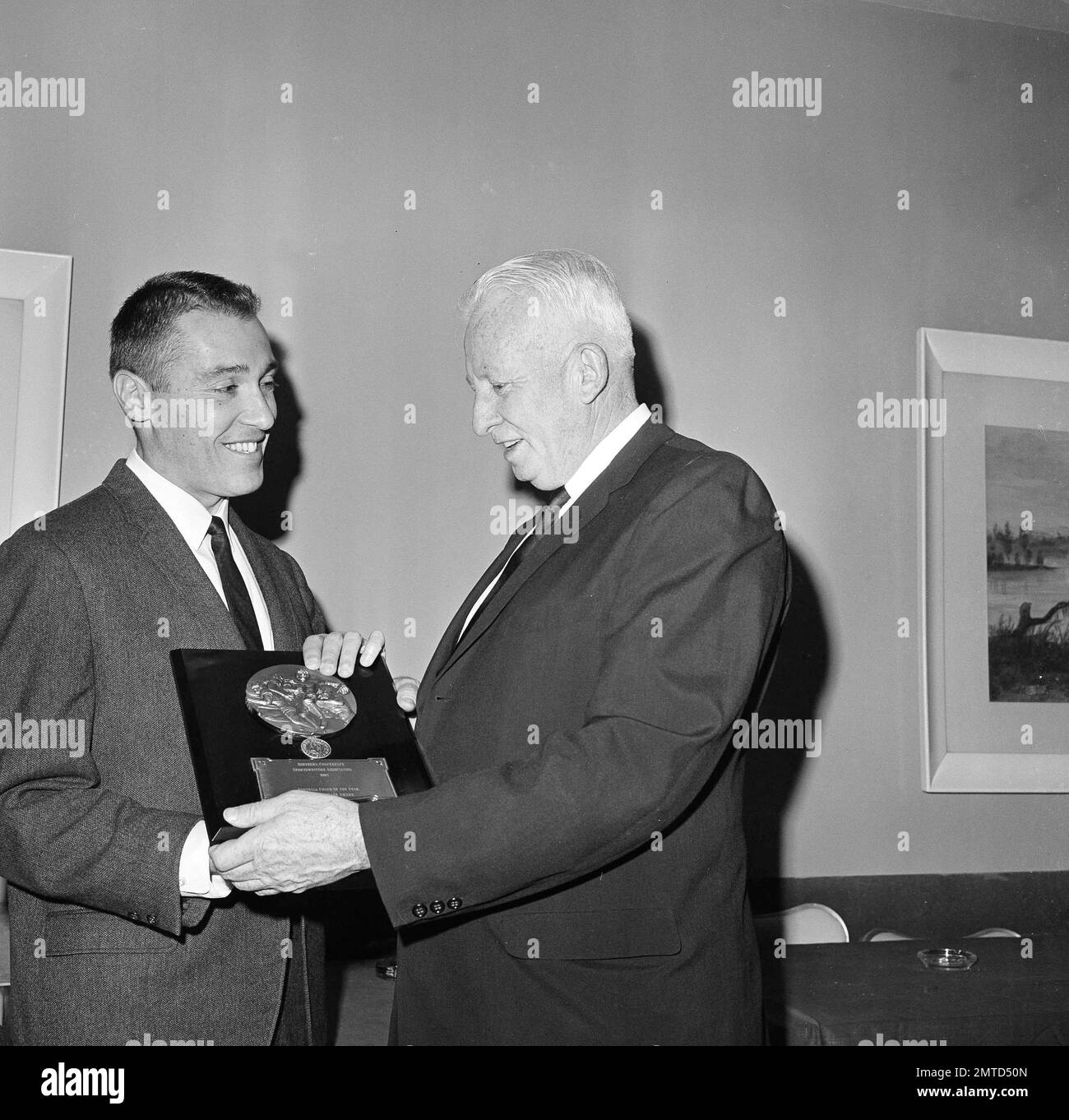 Coach Marv Levy, left, of William & Mary receives the Coach of the Year
