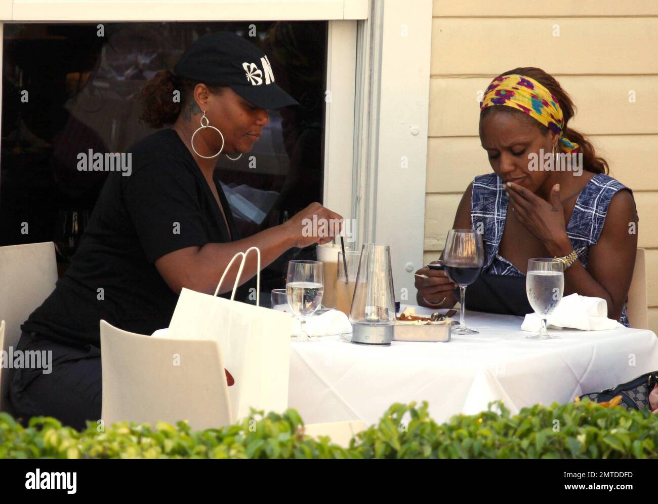 queen latifah smoking cigarette EXCLUSIVE!! Queen Latifah shows off the butterfly tattoos behind her ear as  she has lunch with a friend at Prime 112. During the meal, the two enjoyed  drinks and she sampled her