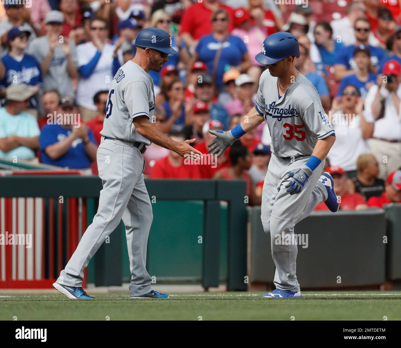 Los Angeles Dodgers' Cody Bellinger (35) celebrates with third base