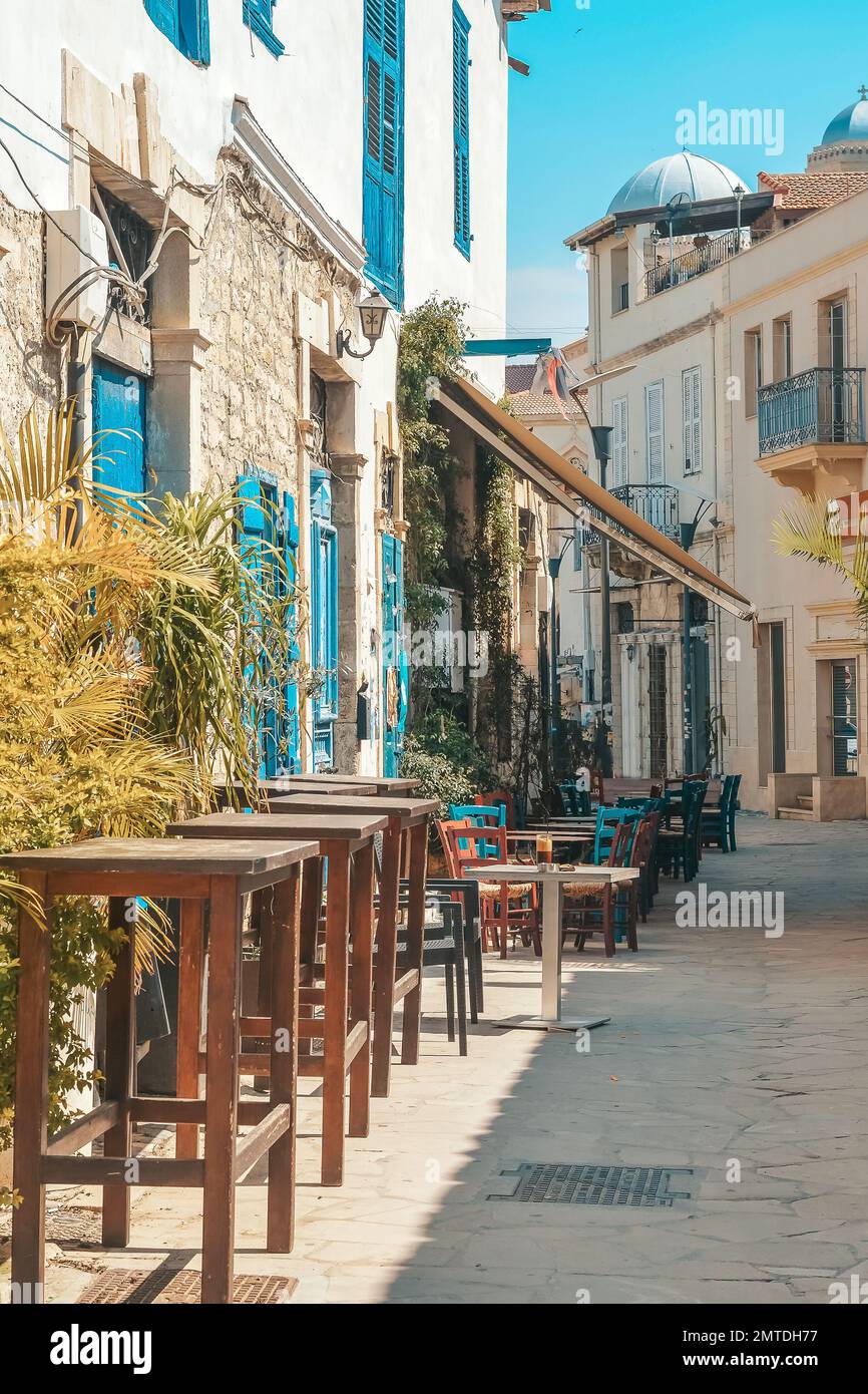 Streets of the old city of Limassol. Blue shutters on the colonial architecture of Cyprus. Stock Photo