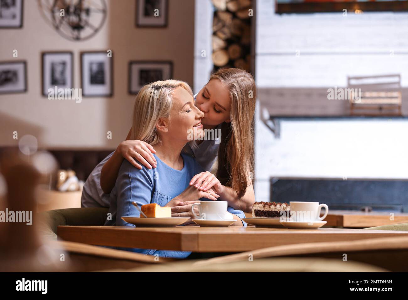 Mother and her adult daughter spending time together in cafe Stock ...