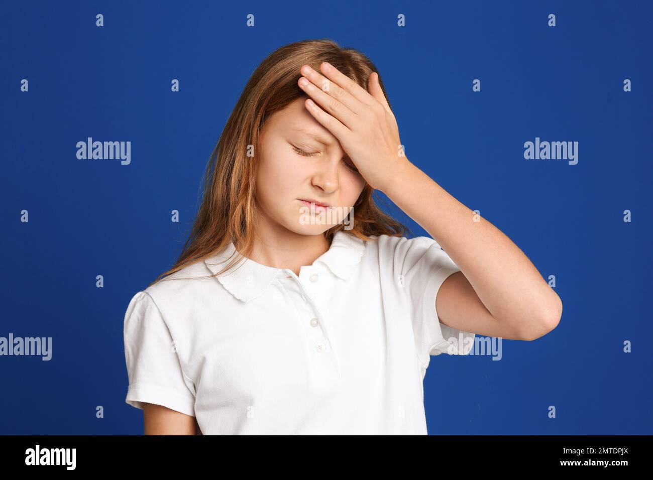 Portrait of emotional preteen girl on blue background Stock Photo - Alamy