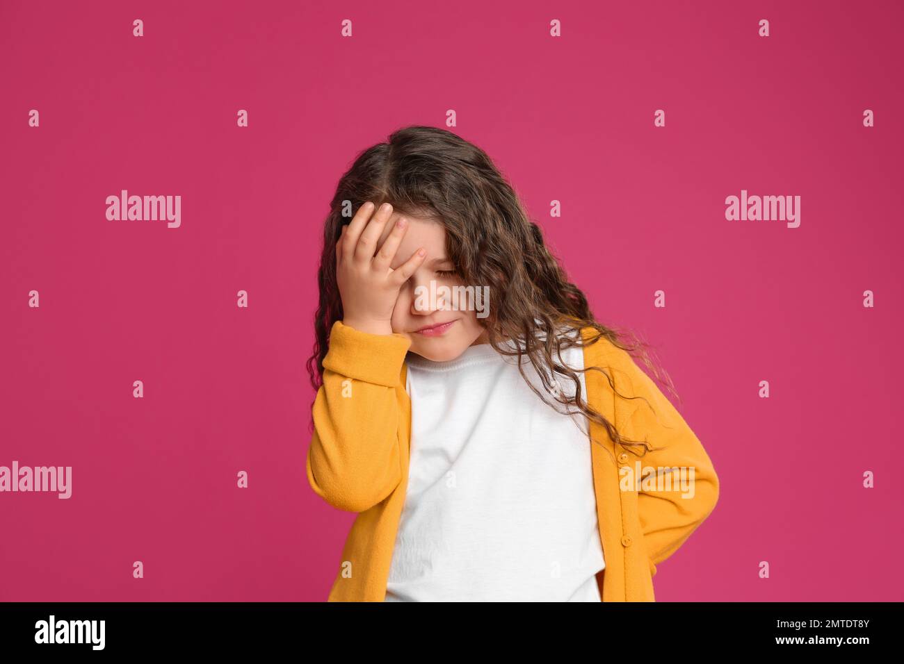 Portrait of cute little girl on pink background Stock Photo - Alamy