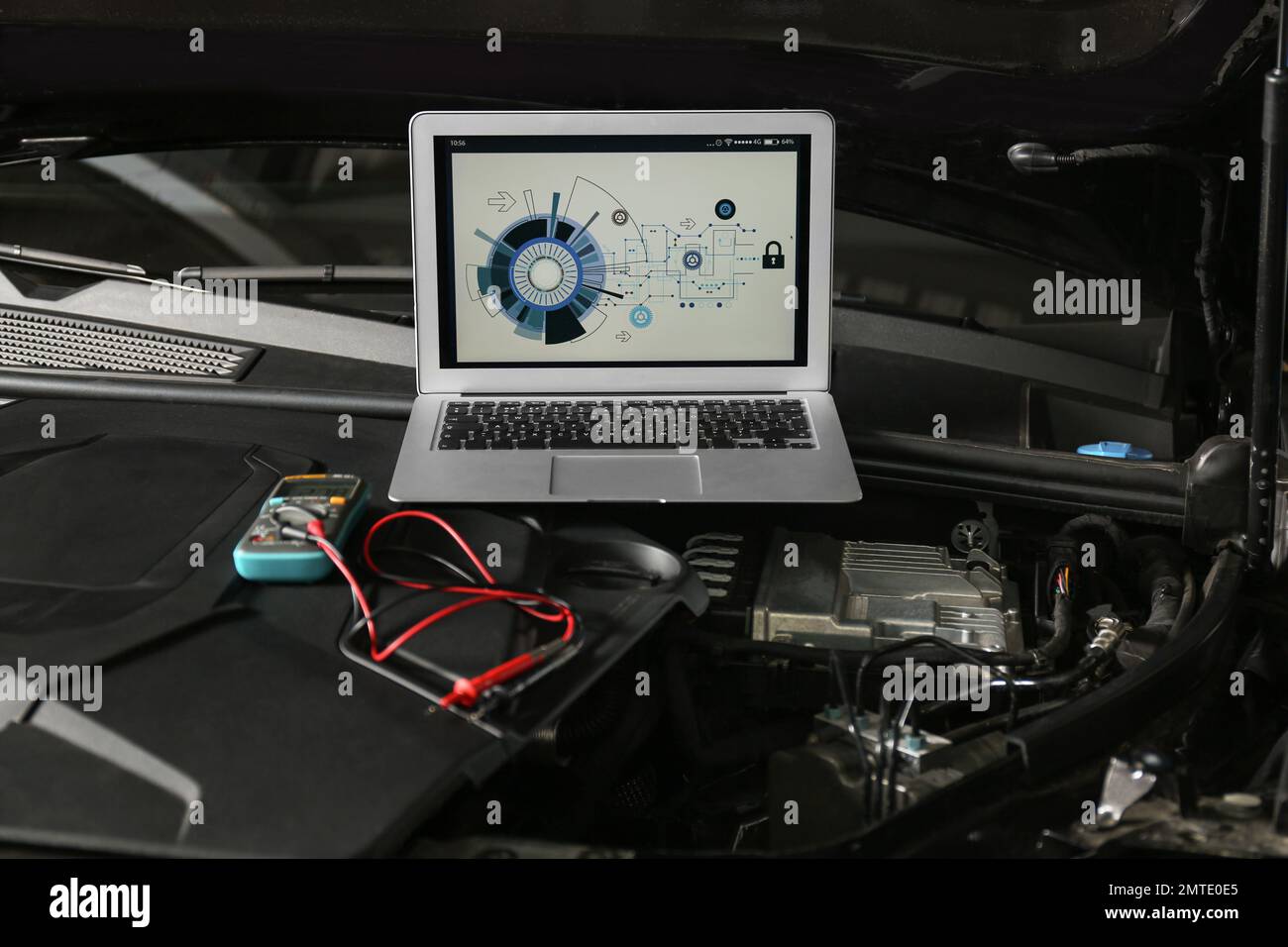 Laptop with diagram on auto engine. Modern car diagnostic Stock Photo
