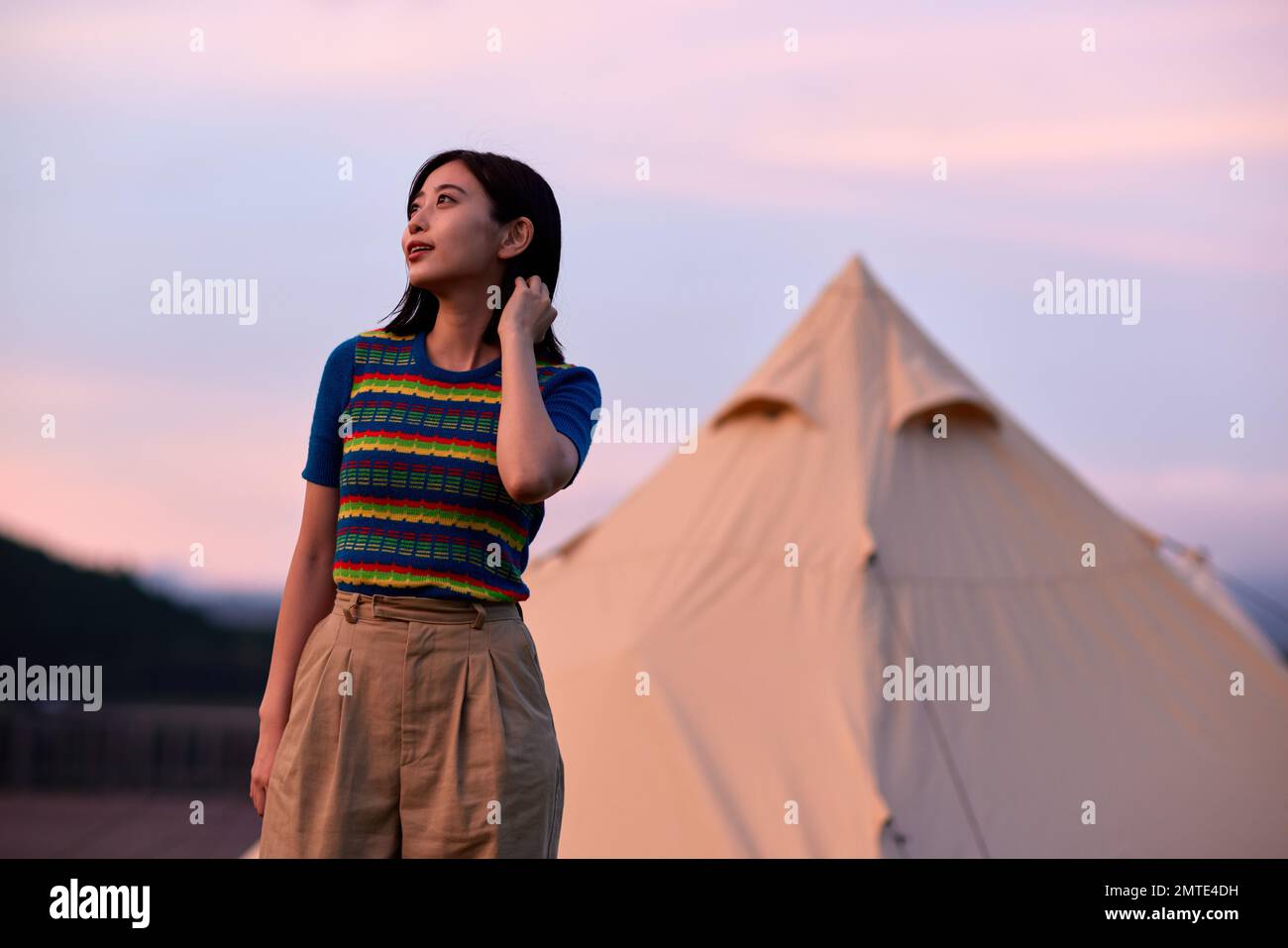 Young Japanese woman portrait at campsite Stock Photo
