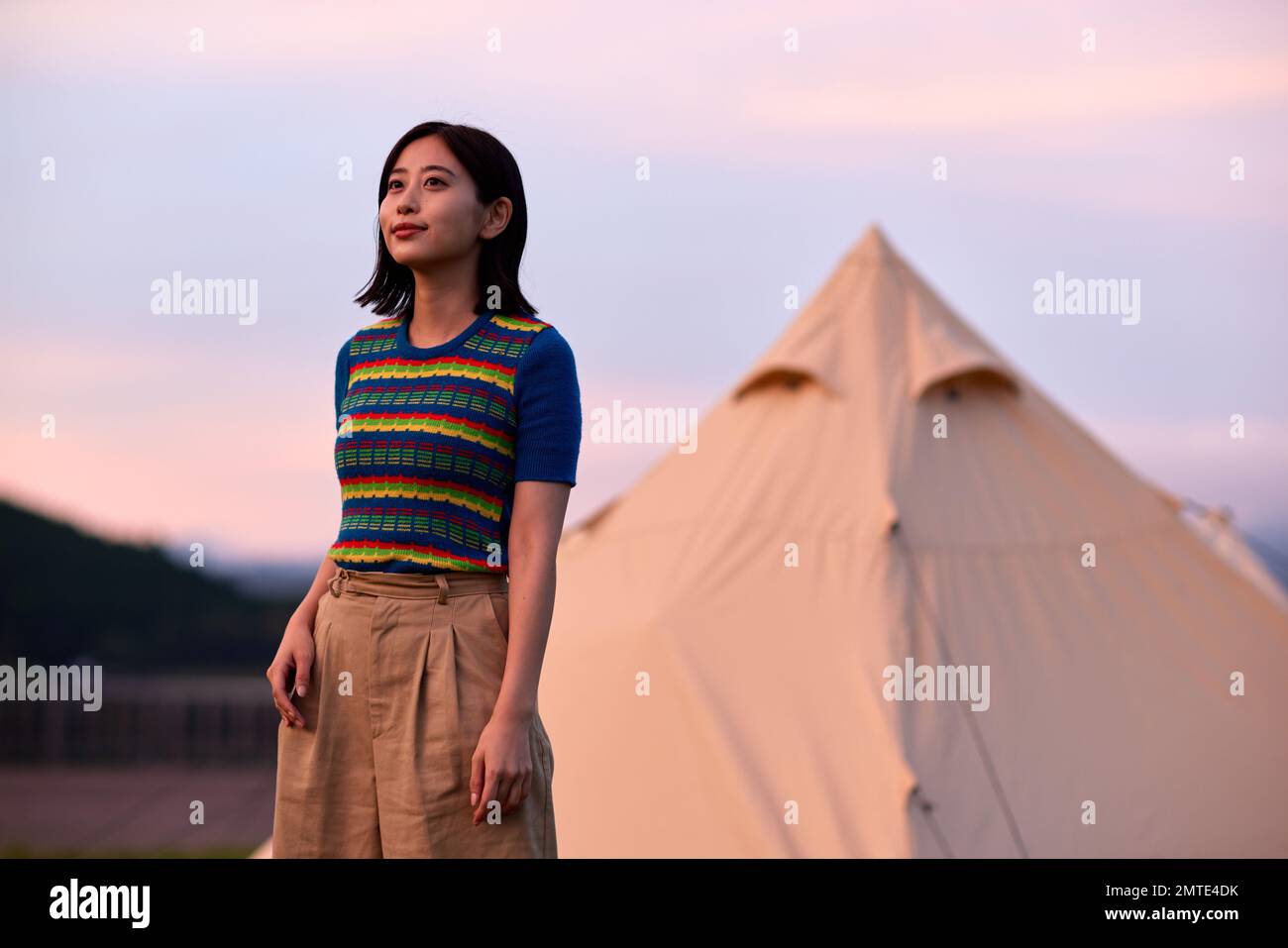 Young Japanese woman portrait at campsite Stock Photo