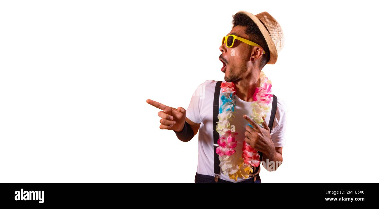 Carnival Outfit Party. Portrait of Black Man With Carnival Props Poiting,  Isolated on Orange Background Stock Photo