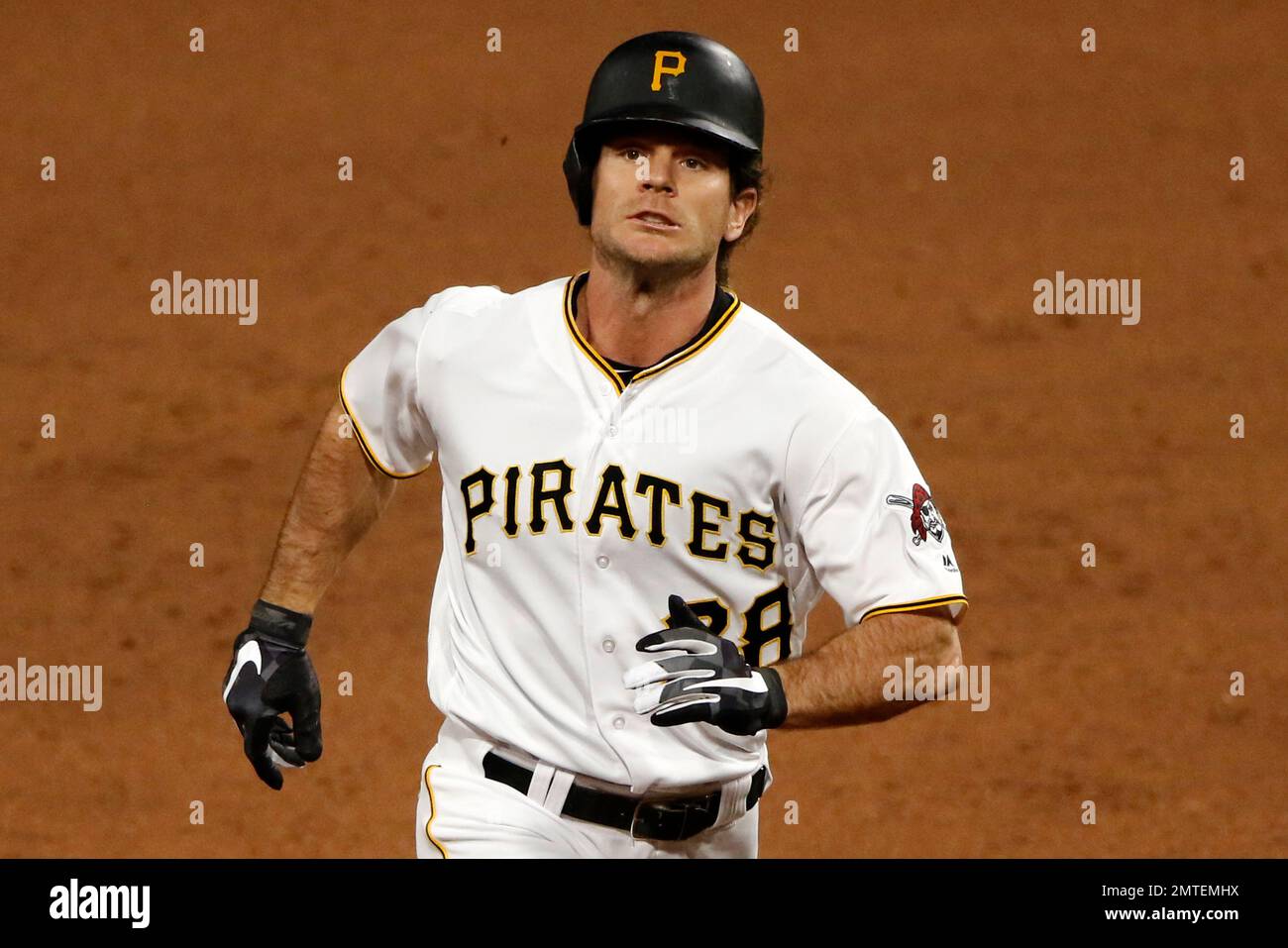 Pittsburgh Pirates' John Jaso rounds second after hitting a tworun
