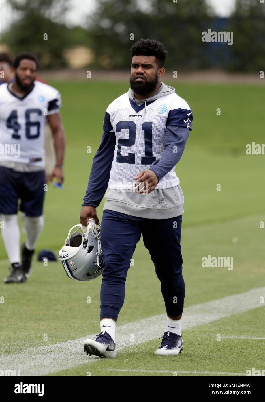 Dallas Cowboys running back Ezekiel Elliott (21) walks off the field after  an NFL football practice at the team's training facility, Tuesday, June 13,  2017, in Frisco, Texas. (AP Photo/Tony Gutierrez Stock