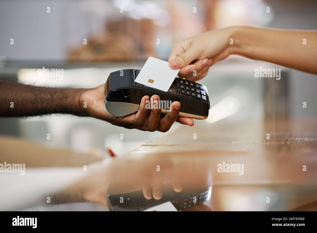 Closeup image of cashier desk worker accepting payment from customer Stock Photo