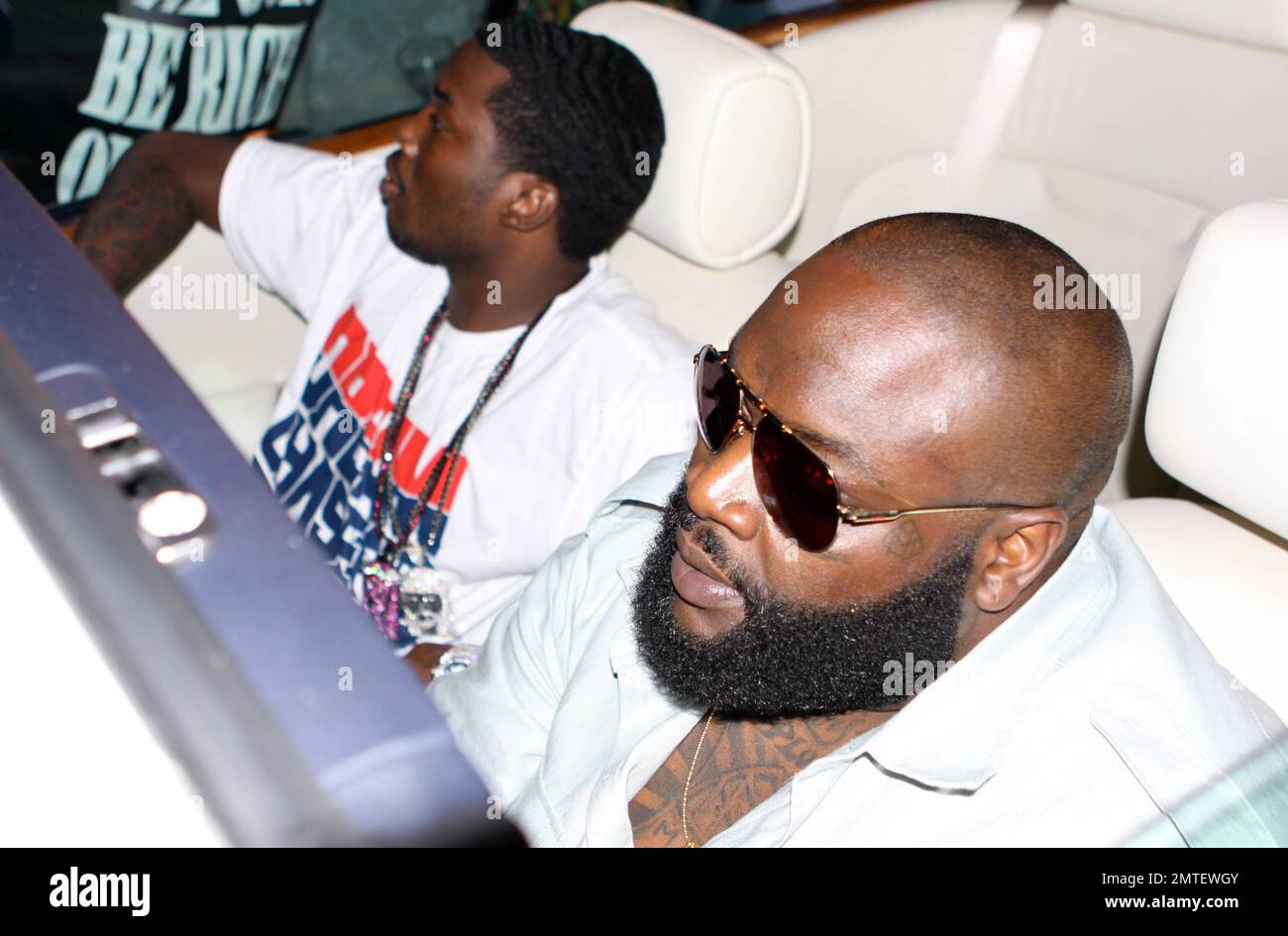 EXCLUSIVE!! Rapper Rick Ross (aka William Leonard Roberts II) attracts a  huge crowd into the street while driving his Rolls Royce convertible on  Collins Avenue in South Beach during Urban Weekend. Also