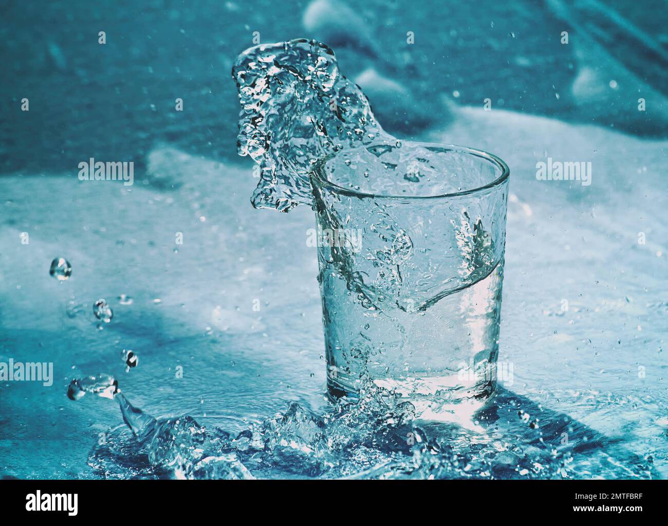 Splashed Glass A glass of water. Splashing water from glass Stock Photo - Alamy