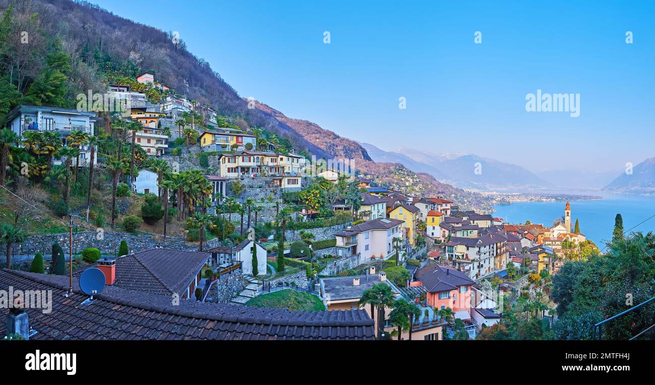 Panorama of the mountain slope, covered with small houses of Ronco sopra Ascona, green gardens and forests, Switzerland Stock Photo