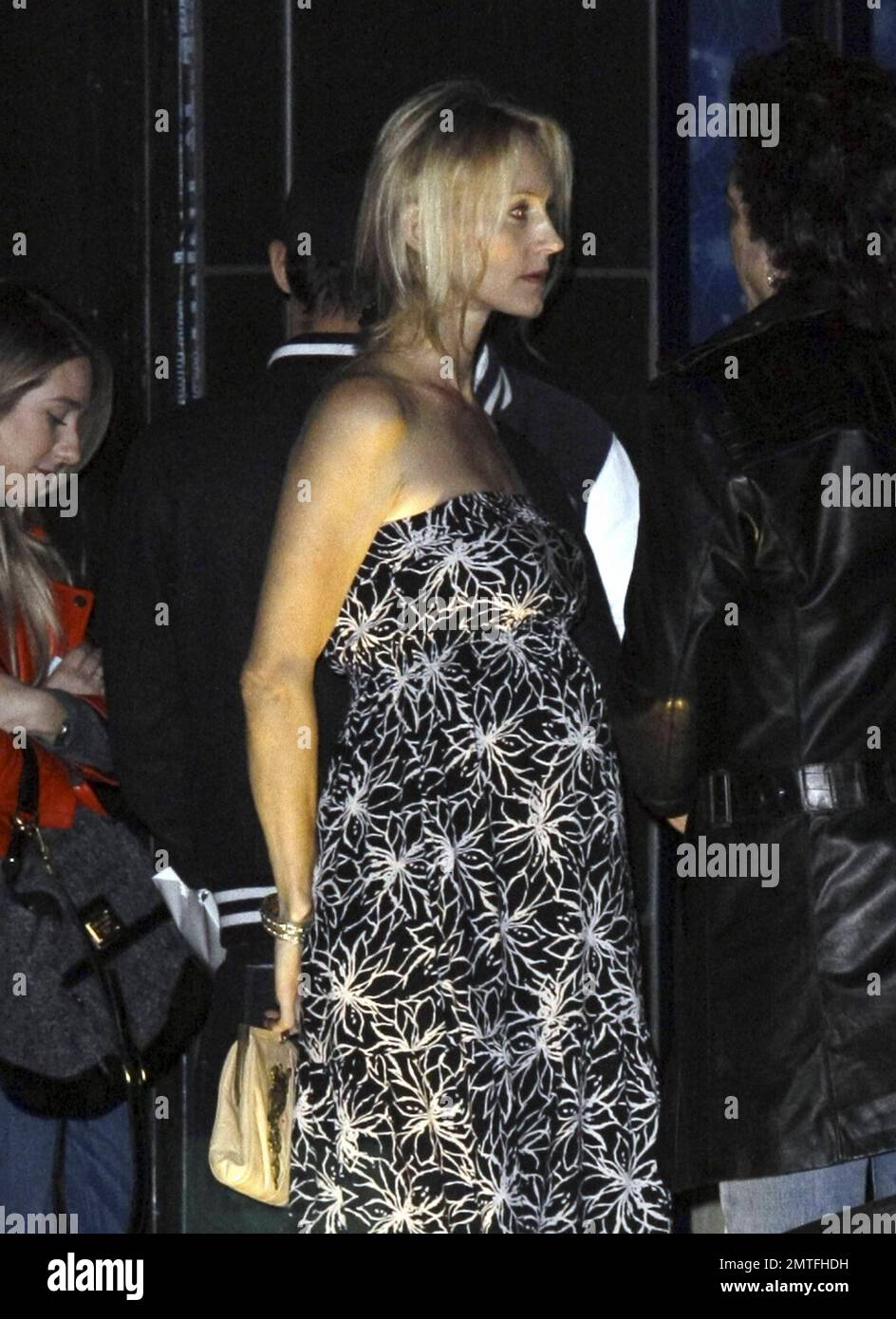 KISS rocker Paul Stanley and pregnant wife Erin Sutton at the Rimowa