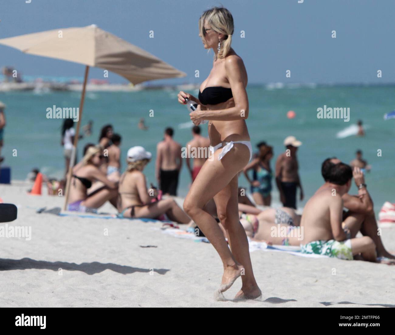 Italian actress Rita Rusic seen relaxing in Miami Beach wearing a skimpy bikini. Miami, FL. 21 August 2011. Stock Photo