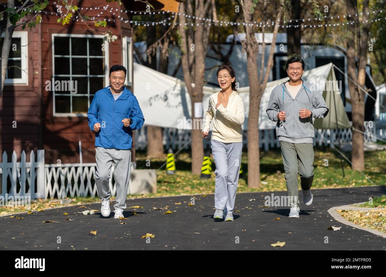 A group of the elderly running fitness with a smile Stock Photo