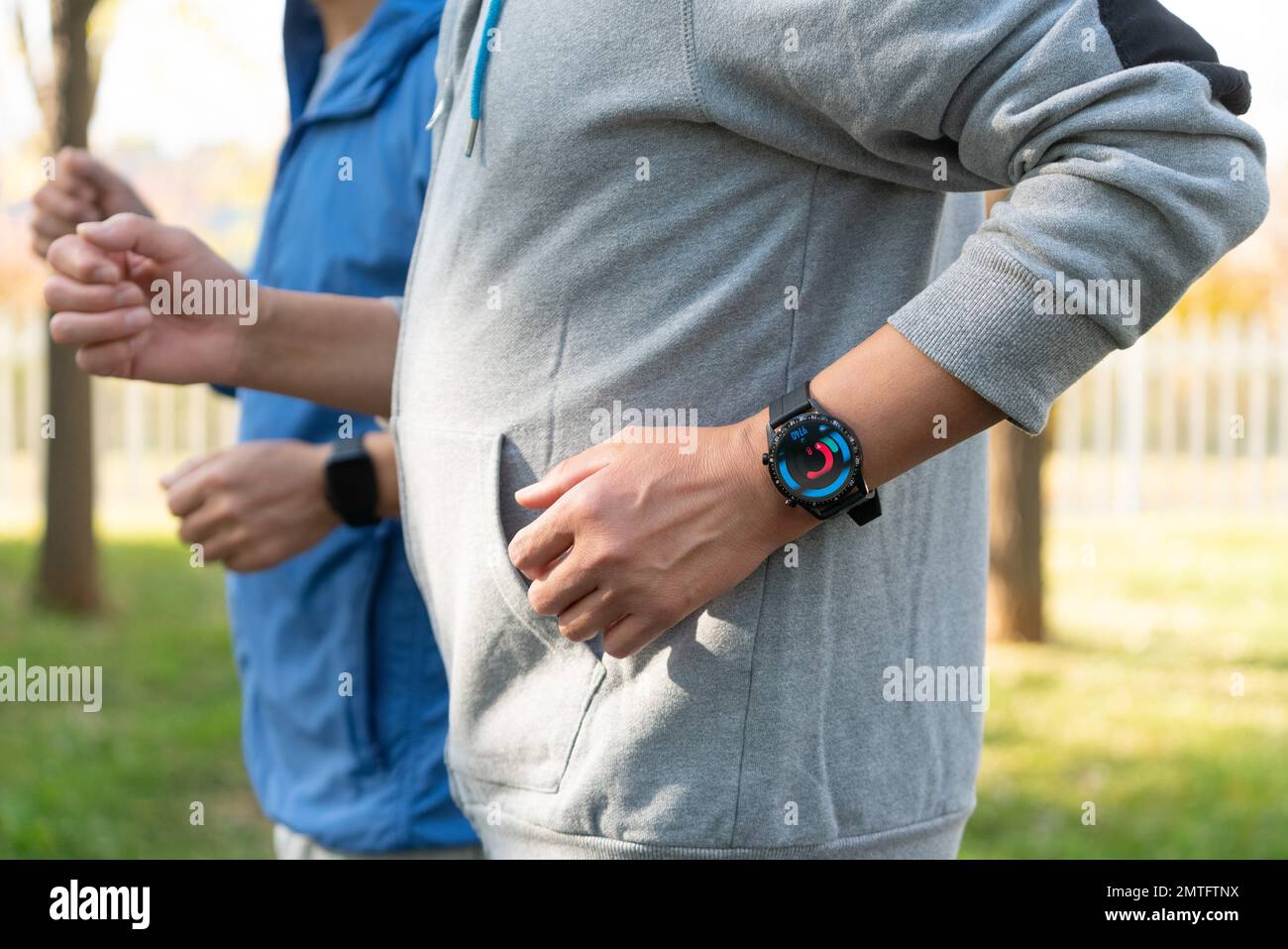 Two elderly men wear sports watches in running Stock Photo Alamy