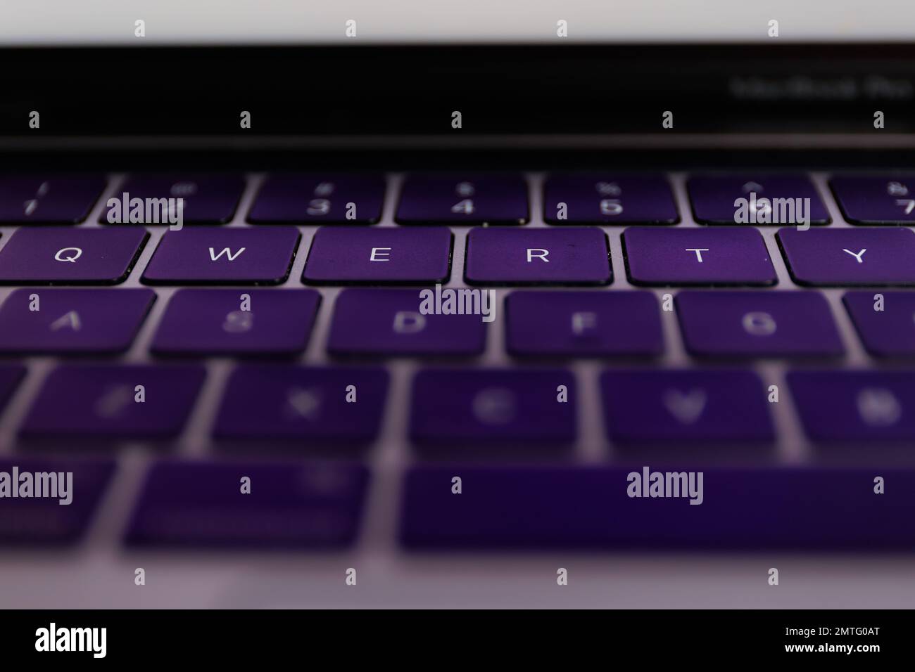 QWERTY keyboard close-up shot. QWERTY is a keyboard layout for Latin-script alphabets Stock Photo