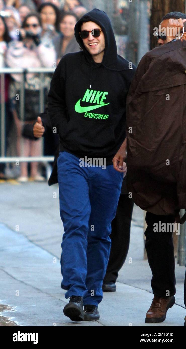 Wearing a black Nike hooded sweatshirt, blue pants and black high-top  sneakers, "Twilight Saga" star Robert Pattinson arrives at the "Jimmy  Kimmel Live" studios. Pattinson is currently promoting his new movie "Water