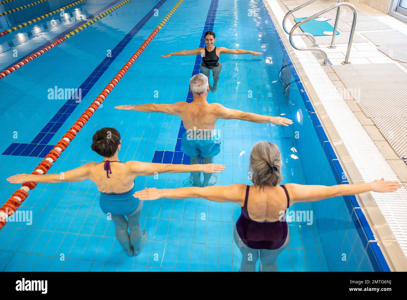 Group of people having a water fitness lesson Stock Photo