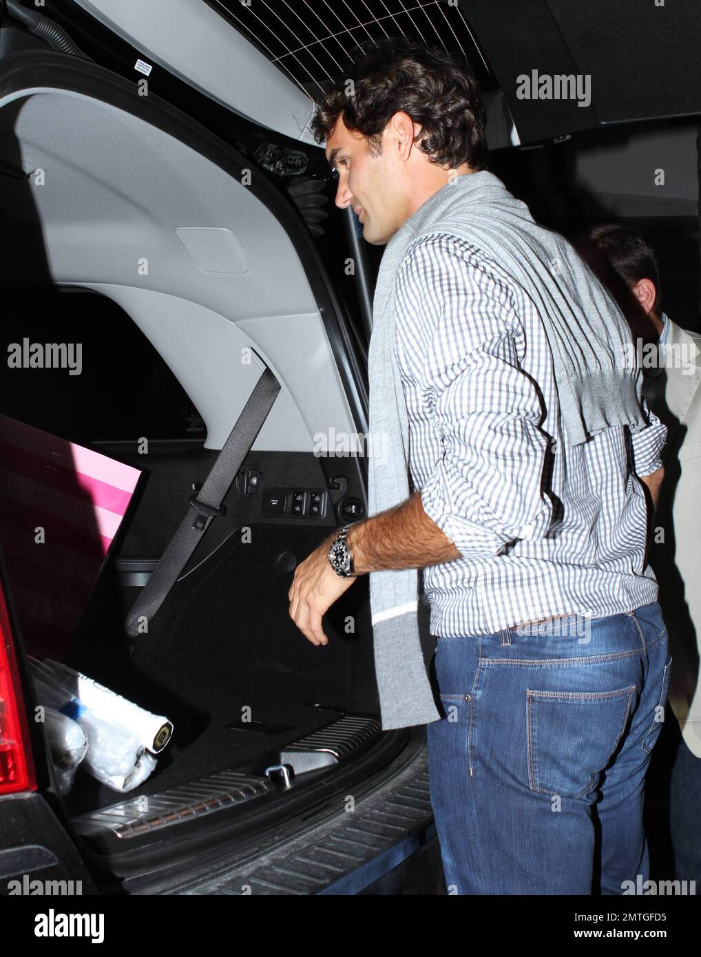 Swiss tennis champion Roger Federer celebrates his wife Mirka Federer's ...