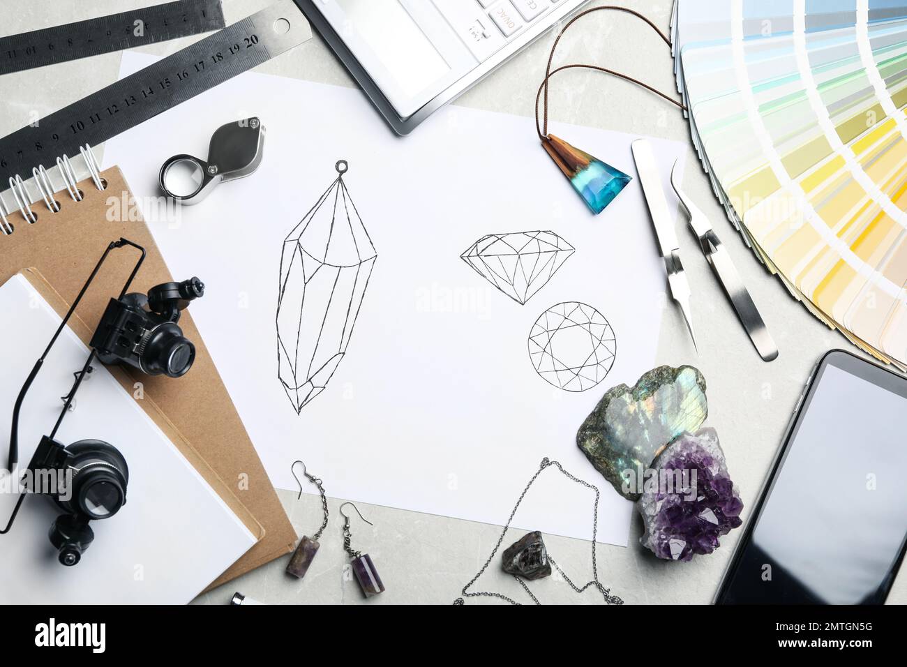 Flat lay composition with drawing of jewelry on light grey table ...