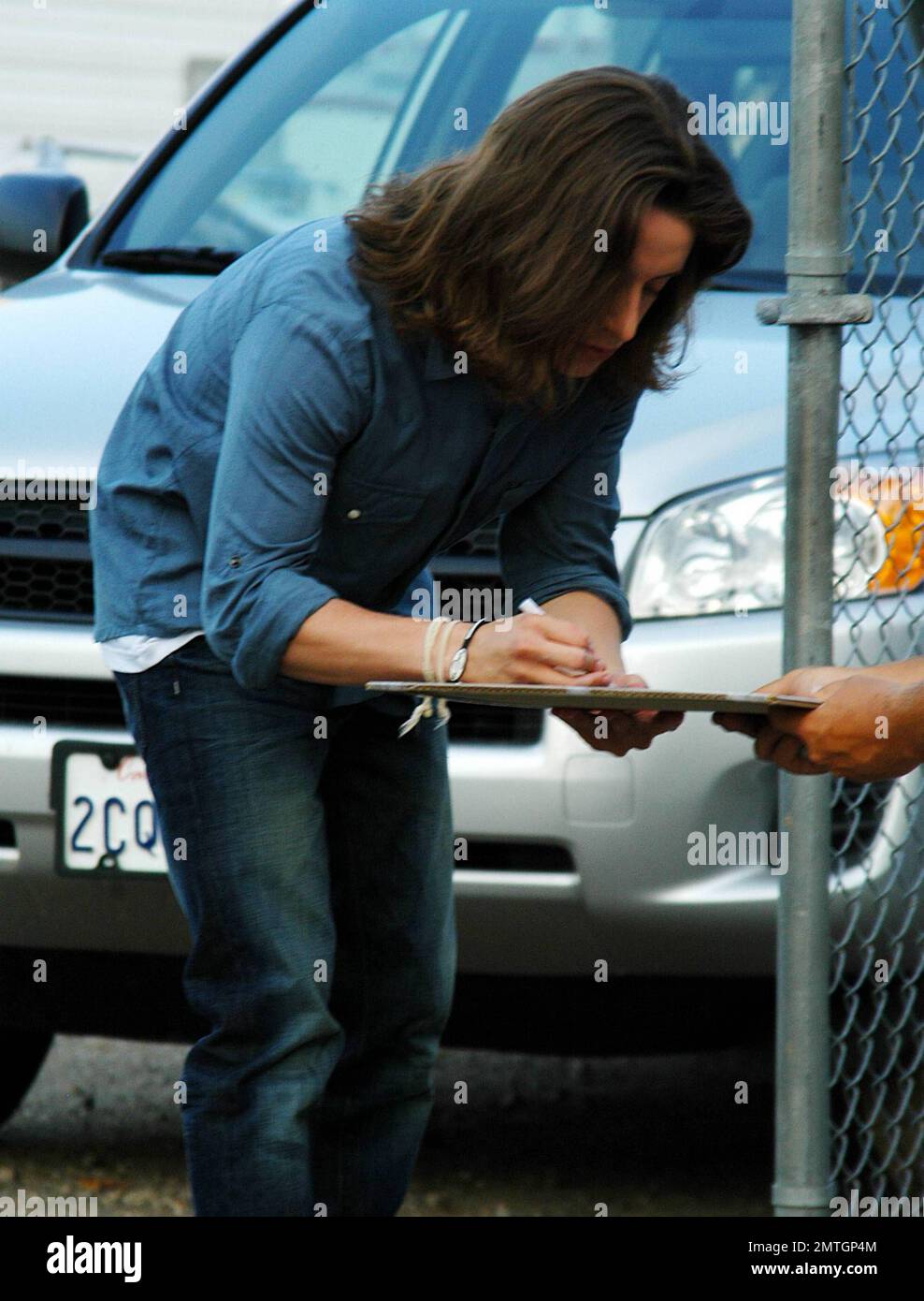 Rory Culkin shows off his long hair as he signs autographs for fans ...