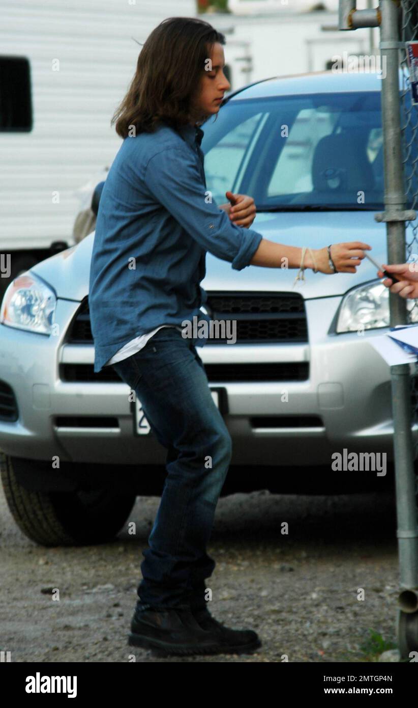Rory Culkin shows off his long hair as he signs autographs for fans