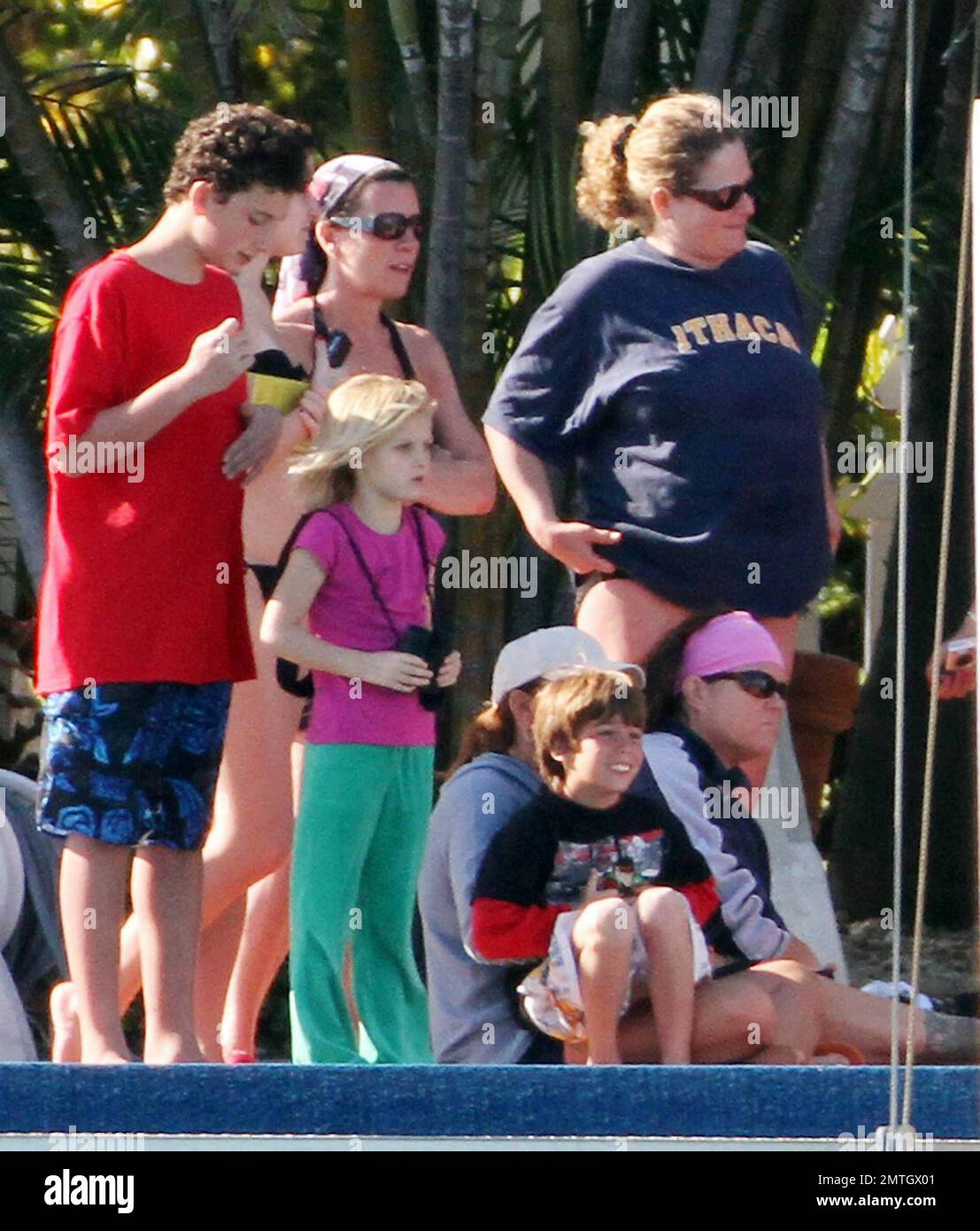 Rosie O'Donnell watches with a large crowd of people as Miami Dade Fire