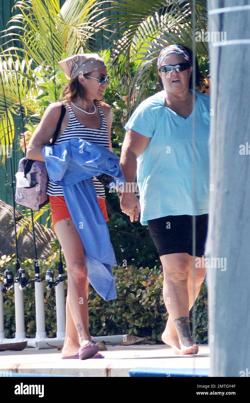 EXCLUSIVE!! Looks like Rosie O'Donnell and girlfriend Tracy Kachtick-Anders may have reconciled after their reported split of Feb 2011. Rosie helped her friend out of a boat and the pair held hands as they walked along a dock after an afternoons boating with two hunky male friends, Miami Beach, FL, 03/23/11. Stock Photo