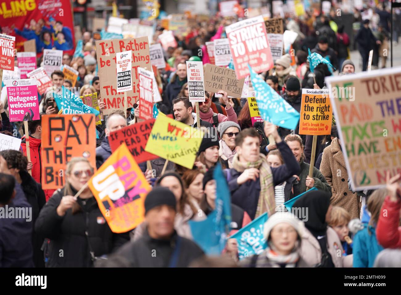 Striking members and supporters of the National Education Union (NEU) on Regents Street, on a march from Portland Place to Westminster where they will hold a rally against the Government's controversial plans for a new law on minimum service levels during strikes. Picture date: Wednesday February 1, 2023. Stock Photo