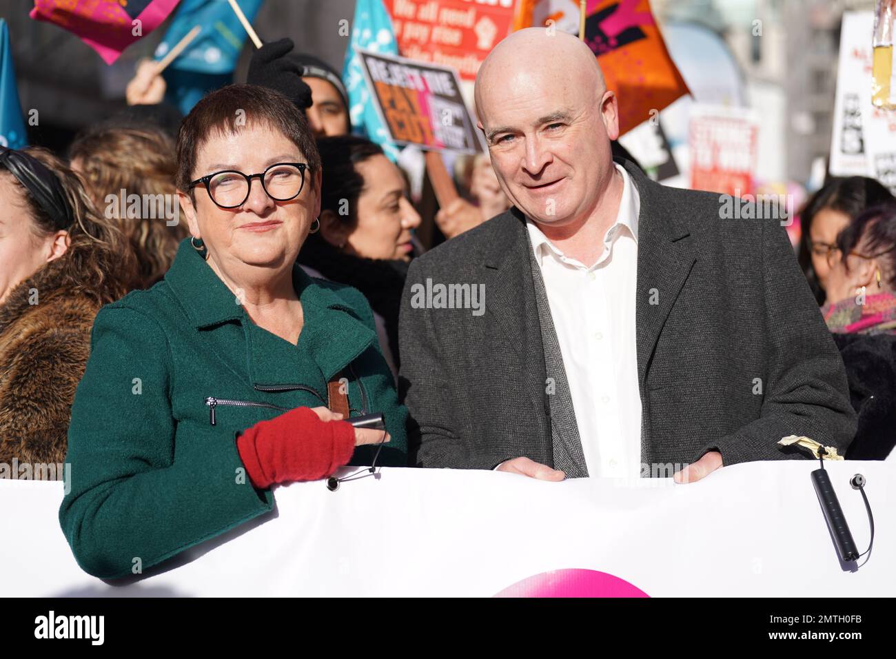 Mick Lynch, general secretary of the Rail, Maritime and Transport union (RMT) and Mary Bousted (left), joint general secretary of the National Education Union join striking members and supporters on a march from Portland Place to Westminster where they will hold a rally against the Government's controversial plans for a new law on minimum service levels during strikes. Picture date: Wednesday February 1, 2023. Stock Photo