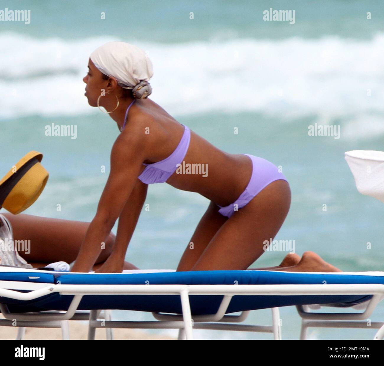 X Factor judge, Kelly Rowland, shows off her enviable figure in a purple  bikini during a relaxing afternoon on the beach before her show tonight at  the American Airlines Arena. Rowland earlier