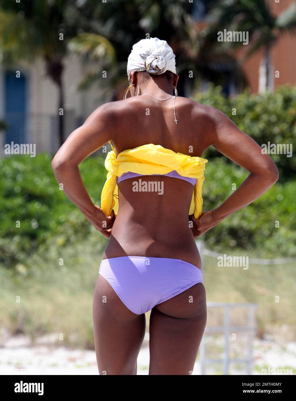 X Factor judge, Kelly Rowland, shows off her enviable figure in a purple  bikini during a relaxing afternoon on the beach before her show tonight at  the American Airlines Arena. Rowland earlier