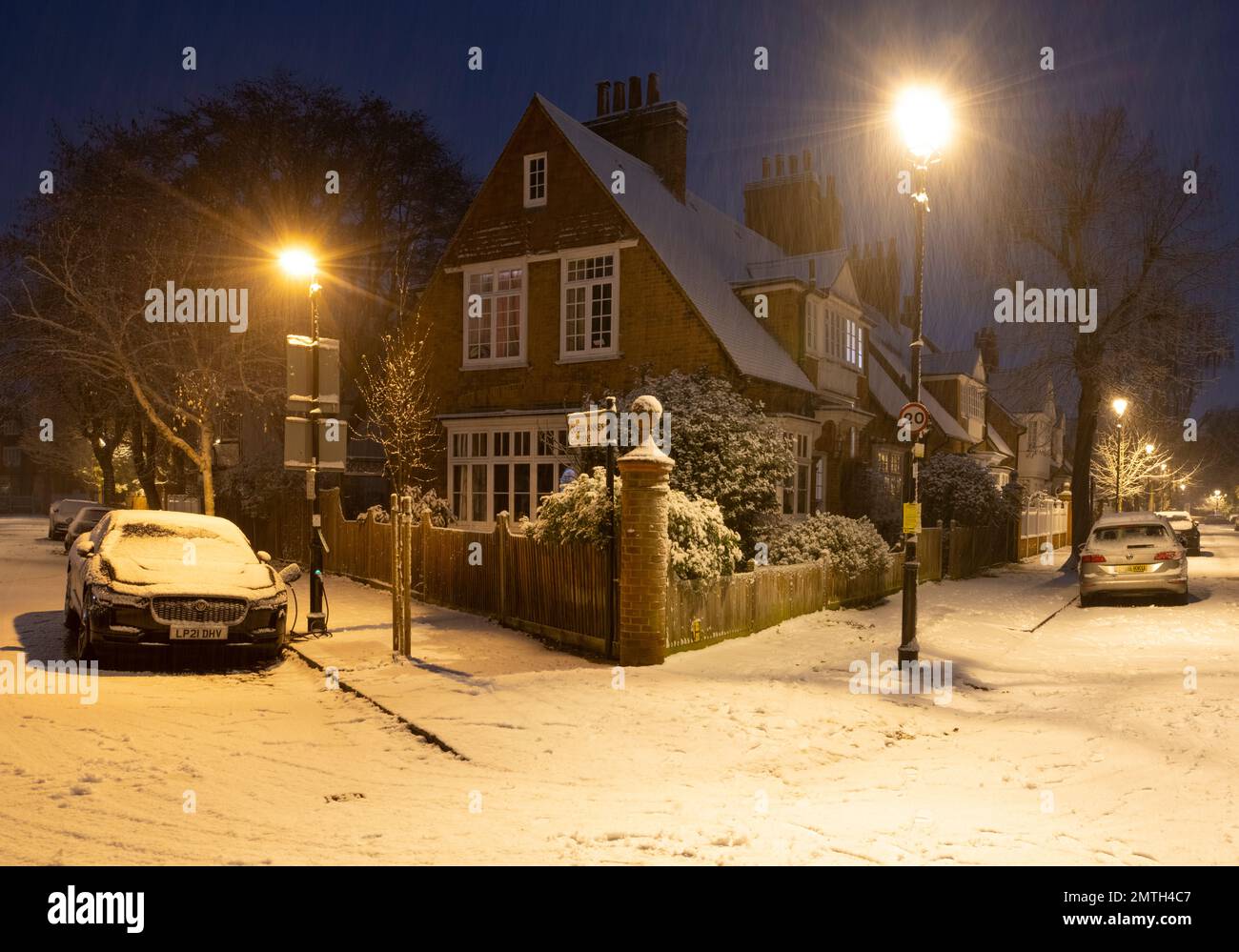 Snow falling over Arts and Crafts style houses in Bedford Park