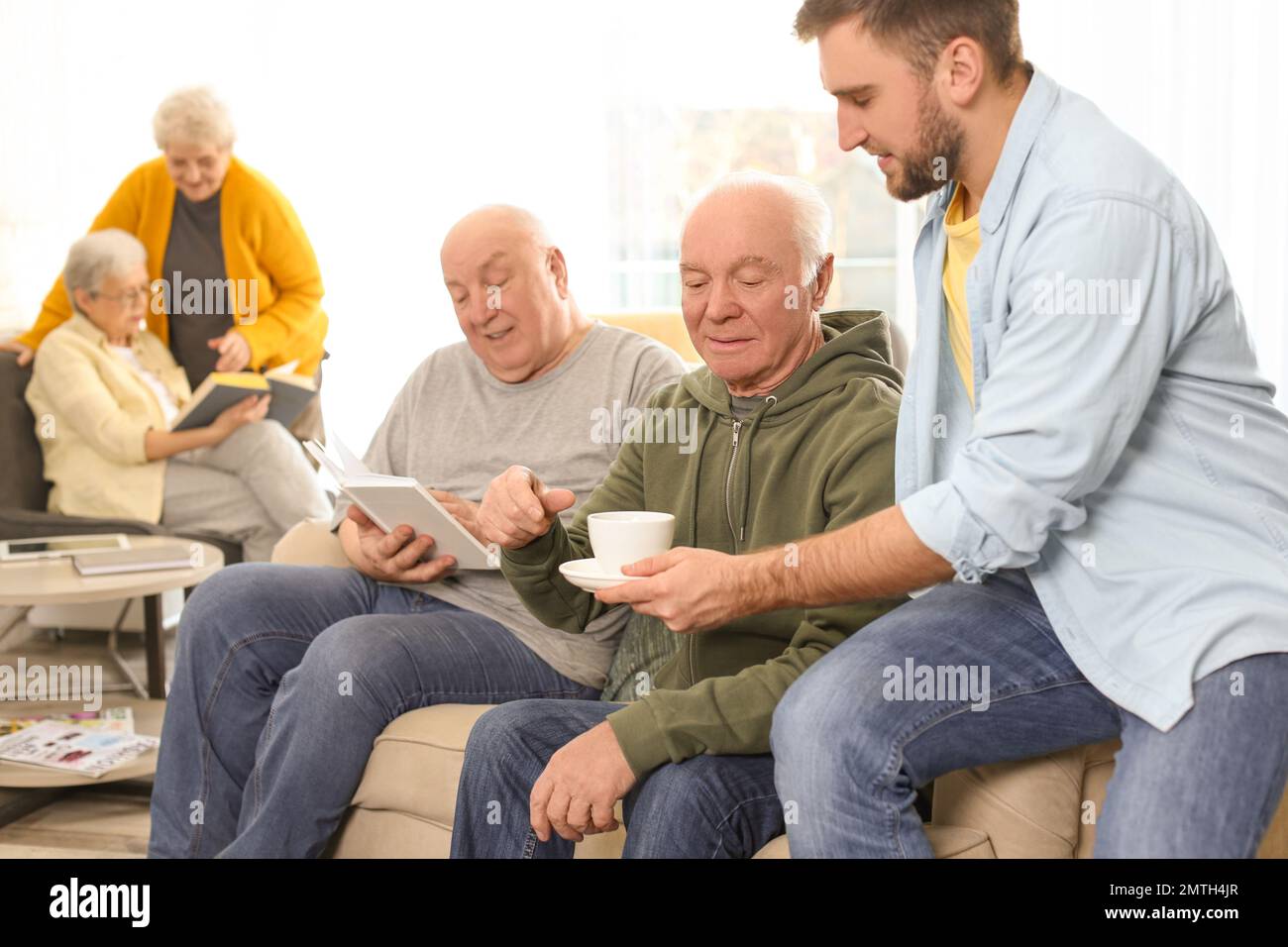 Young male care worker elderly hi-res stock photography and images - Alamy