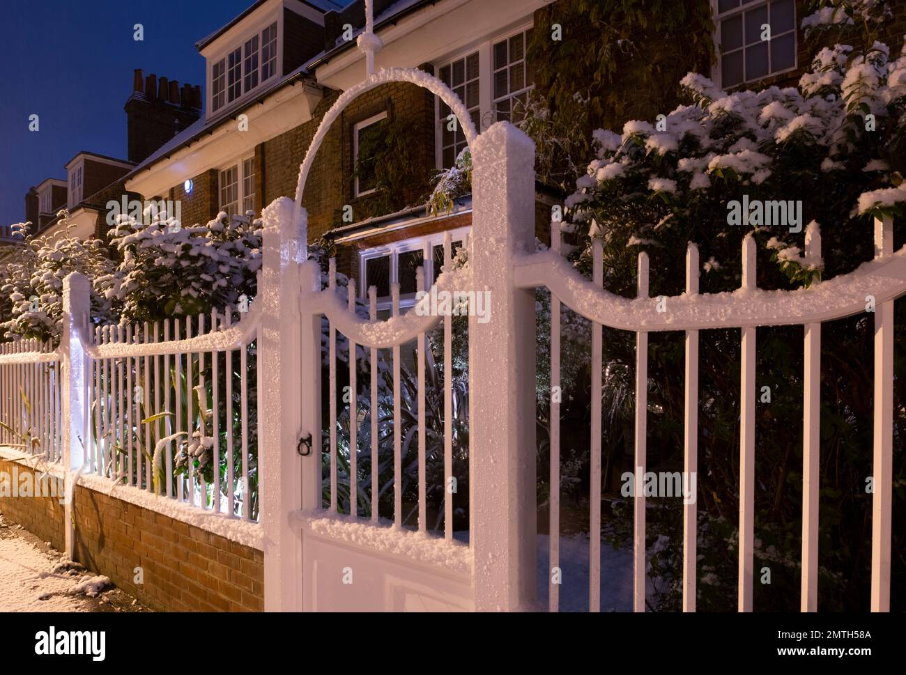 Snow falling over Arts and Crafts style houses in Bedford Park